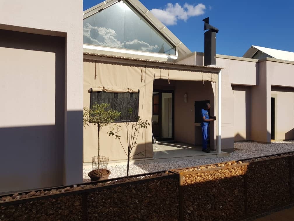 Cream patio awning on modern residential home