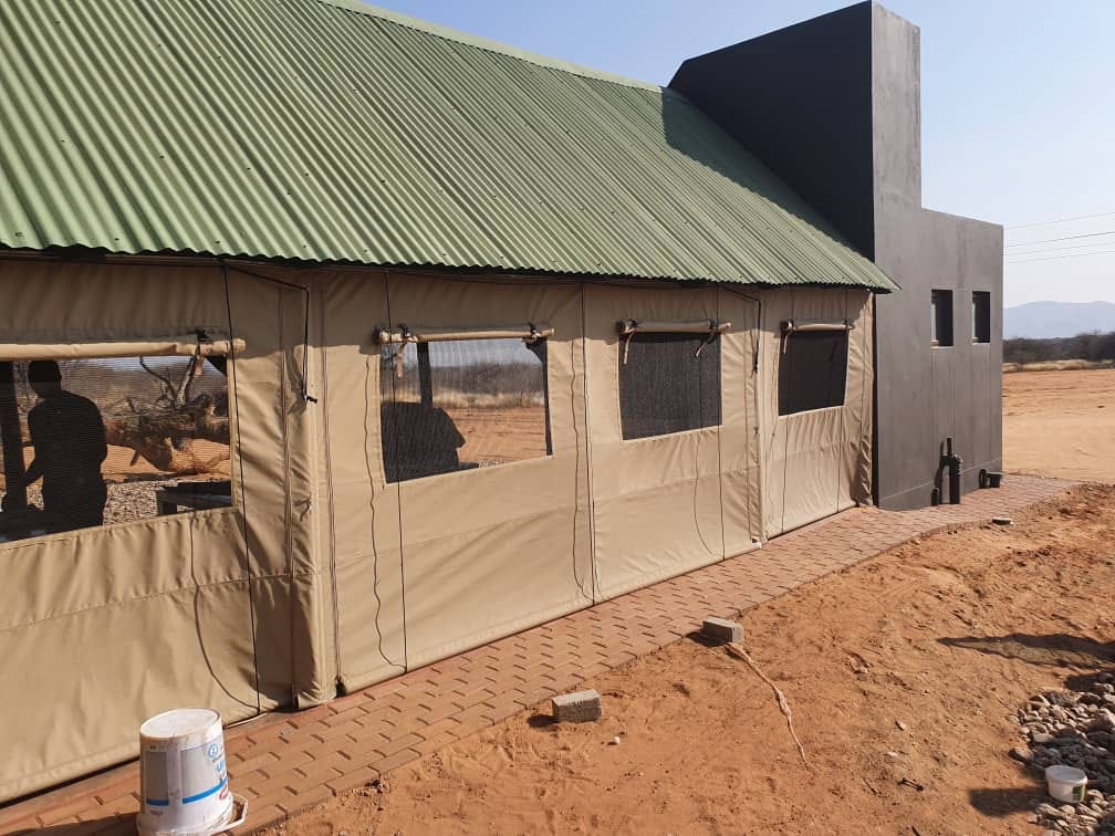 Custom canvas enclosure installation on building, Namibia