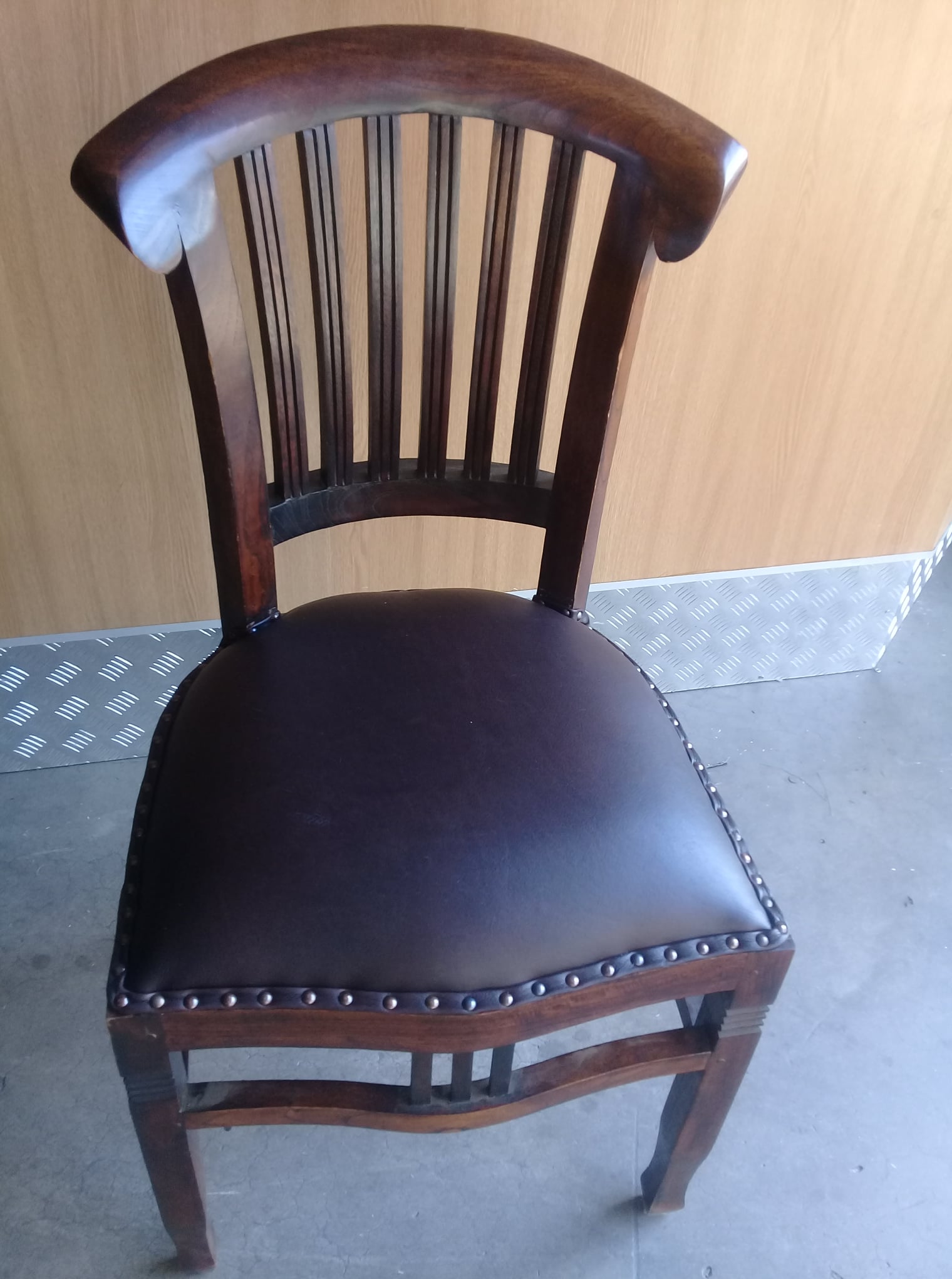 Antique dining chair re-upholstered in brown leather