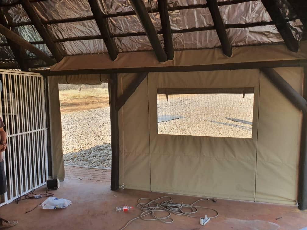 Canvas-enclosed lapa interior with mesh windows