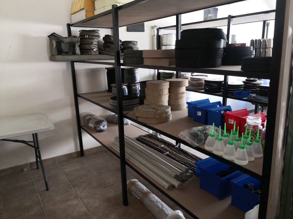 Shelving with thread cones and edging tape